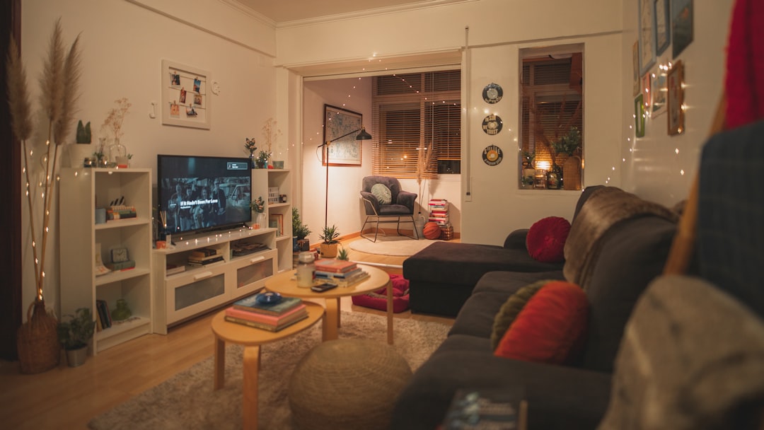 Pet Companionship in a warm living room with a person, a dog, and a cat sharing a calm evening routine