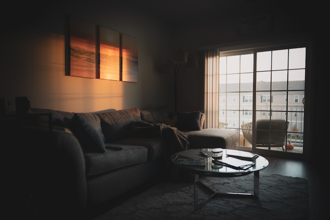 Pet Companionship Tips showing a person sitting on the floor with a dog and cat in a quiet living room